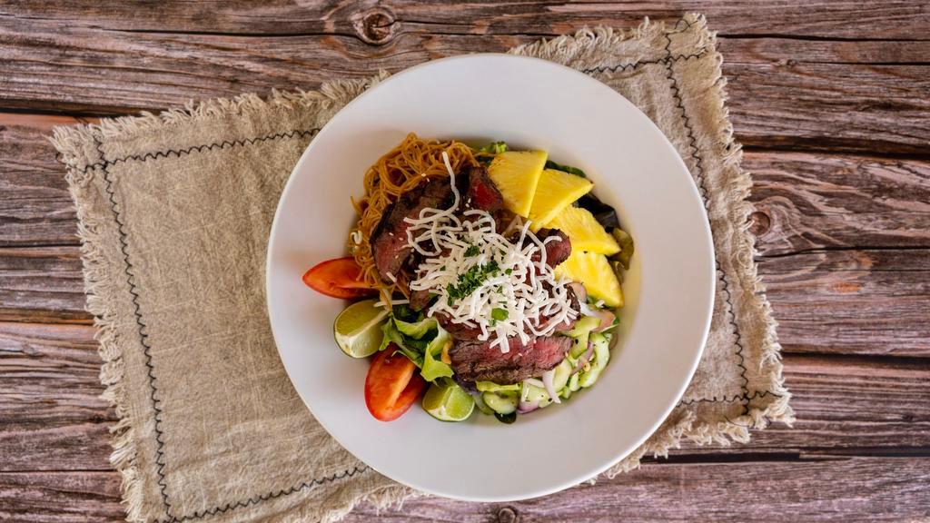 Thal Beef Salad · Skirt steak, marinated noodles and cucumber, onions, baby mixed greens, peanuts, pineapple and green curry vinaigrette
