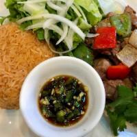 Com Bo Luc Lac · Shaken beef with rice.