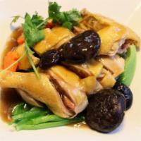 Com Ga Hap Cai Be Xanh An Nam · Chicken with mustard greens, shiitake mushrooms, & sauce over rice.