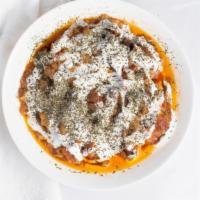 Vegi Borani Badejan · Eggplant sautéed with fresh tomatoes, garlic and peppers, topped with our special sauces and...