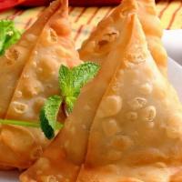 Samosa · Crispy puff filled with potatoes and green peas.
