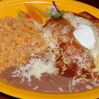 12. Red Enchiladas · Two corn tortillas stuffed with your choice of meat or cheese. Served with rice and refried ...
