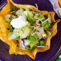 Taco Salad · Choice of meat. With rice, whole beans, sour cream and guacamole.