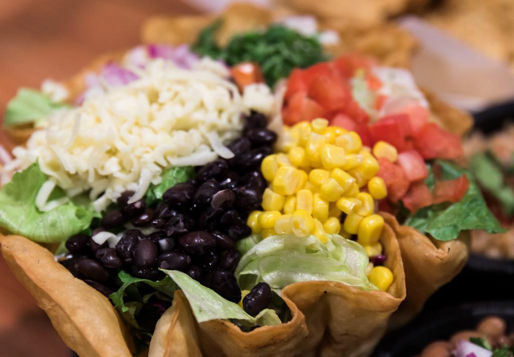 El Patio’s Salad Bowl · Flour tortilla shell filled with refried beans, rice,
salad mix, red onions, tomatoes, corn,
cilantro, black beans, and jack cheese.