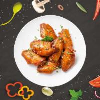 Beyond Wings · Bone-in traditional chicken wings in a choice of buffalo, sweet chili garlic or our signatur...
