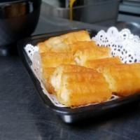 Chinese Donuts 油條 · Savory fried dough usually dunked into porridge for consumption.