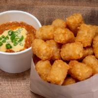 Chili Cheese Tots · Crispy tots with our signature chili & cheese sauce