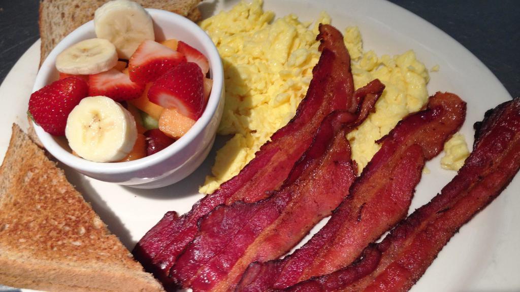 Bacon  · 4 strips of bacon served with 2 eggs with your choice of side and toast or available substitution.