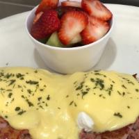 Corned Beef Hash Benedict · Served with two poached eggs a top an english muffin with hollandaise sauce.