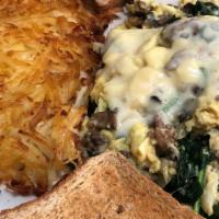 Page's Special Scramble · Ground beef, onions, spinach, mushroom, jack cheese.