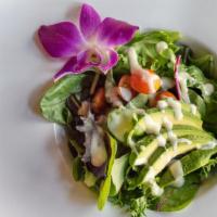 House Salad · Artisan spring mix with tomato, avocado and miso salad dressing.