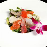 Spicy Sashimi Salad · Artisan spring mix with cucumber, assorted sashimi and a spicy house sauce.
