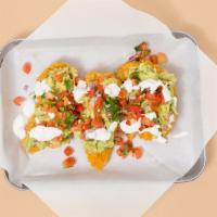 Southwestern Tenders · Three crispy fried chicken tenders layered with guac, pico de gallo, sour cream, plus your c...