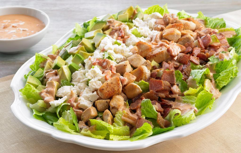 Cobb Salad · Mixed Greens, White Chicken Meat, Hard Boiled Egg, Grape Tomatoes, Cheddar and Monterey Jack cheeses, black olives and Bacon bits with a lite blue cheese dressing