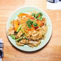 Pad Kee Mao · Flat rice noodles stir-fried with a homemade spicy sauce, choice of protein, bell peppers, w...