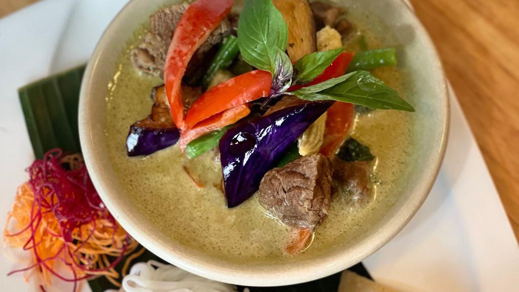 Oh! Beef Curry · Rich, creamy, and savory. Slow-cooked beef in green curry, eggplant, bell peppers, green beans, baby corn, and basil served roti and vermicelli noodles.