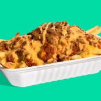 The Shop Chili Cheese Fries · Step up your fry game with Impossible™ Chili & plant-based cheese sauce-smothered fries with...