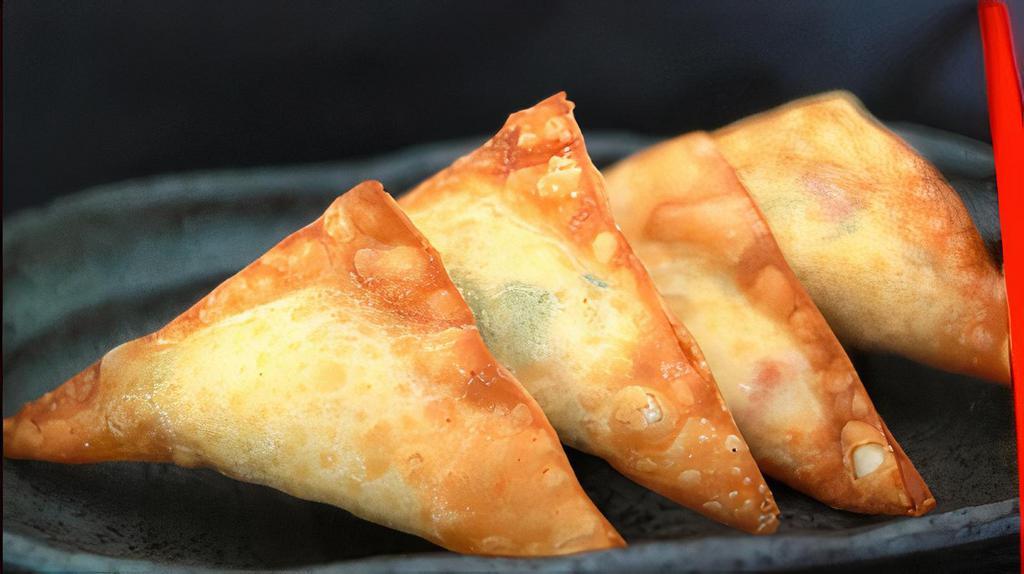 Crab Rangoon  · Crispy wonton with crab meat and cream cheese. Served with one sweet chili sauce.  4pcs