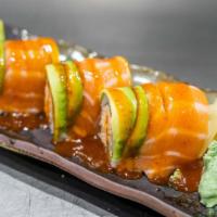 Tiger Roll · Spicy crab meat, salmon, & Avocado on the top with special sauce, with ginger/ wasabi.