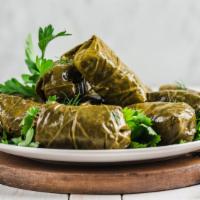 Vegan Dolma · Freshly made grape leaf stuffed with basmati rice, spices, lemon juice and olive oil.