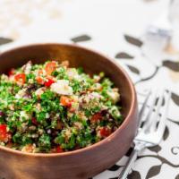 Vegan Tabouleh Salad · Fresh diced parsley, bulgar wheat, red diced onions, red tomatoes and olive oil.