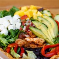 Andale Tostada Salad · Choose your filling,  mixed greens, avocado, black beans, queso, pico de gallo, cucumber, ma...