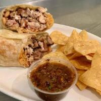 Andale Supremo Burrito · Choice of filling, beans, rice, guac, crema, cheese, salsa, tortilla chips and roasted tomat...