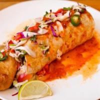 Baja Fish Burrito · Beer battered Alaskan Cod, spicy cabbage slaw, salsa, beans, rice and salsa on the bottom