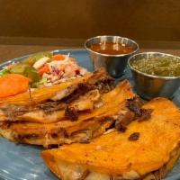 Quesabirria Tacos · 3 Corn tortilla tacos- 24 hour marinated slow cooked Skirt steak with melted cheese using ou...