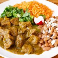 Chile Verde · Tender pieces of pork, slow cooked in a  salsa verde, beans, rice, guac