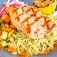 Salmon a la Parrilla · Grilled salmon, garlic butter, seasonal vegetables, cilantro rice, organic corn tortillas