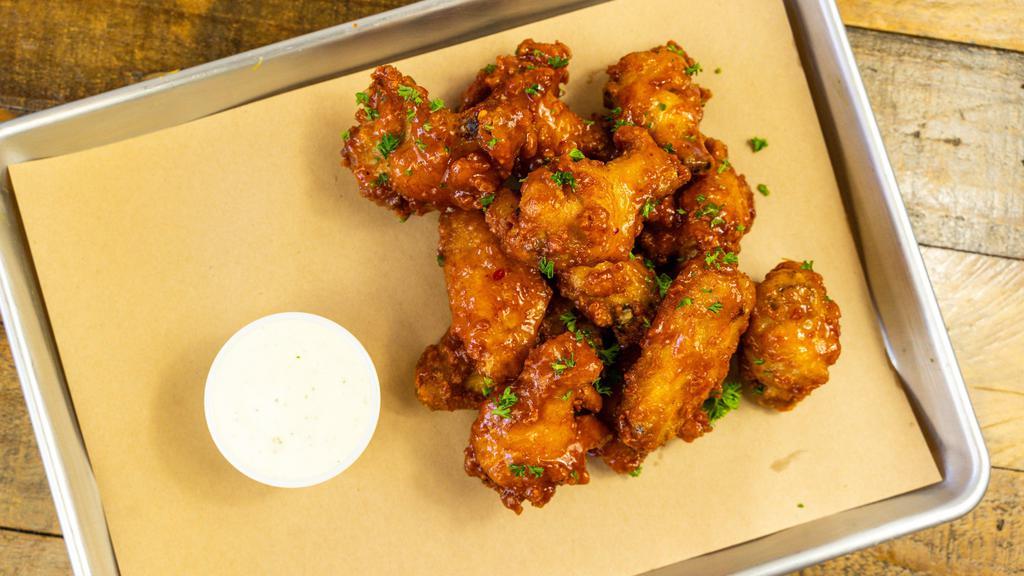 Chicken WIngs (12 pieces) · Your choice of two sauces:  buffalo, barbeque, or mango habanero. * Comes with a side of Ranch
