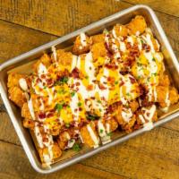 Yaya's Loaded Tots · Bacon, Cheese, and Drizzled Ranch