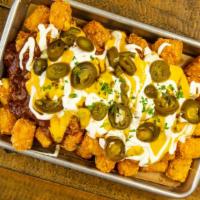 Nacho Business Tots · Cheese, Chili, Sour cream and Jalapenos