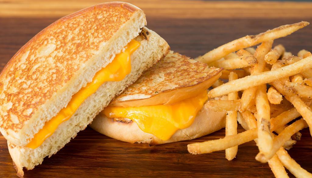 Kid Grilled Cheese · Served with apple sauce and fries and a drink.
