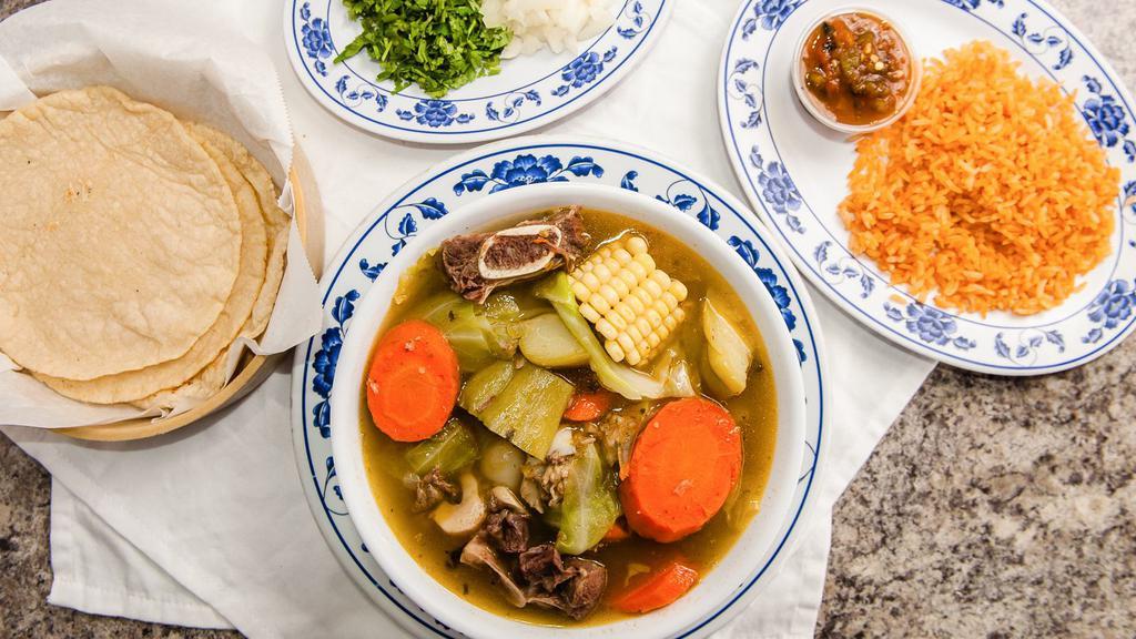 Caldo de Res · 32 ounce hearty soup made with beef shank with bone, pieces of potatoes, carrots, chayote, cabbage, and corn. Served with a side of Mexican rice, your choice of tortillas, chunky molcajete salsa, fresh onions, cilantro, and limes to prepare to taste.
