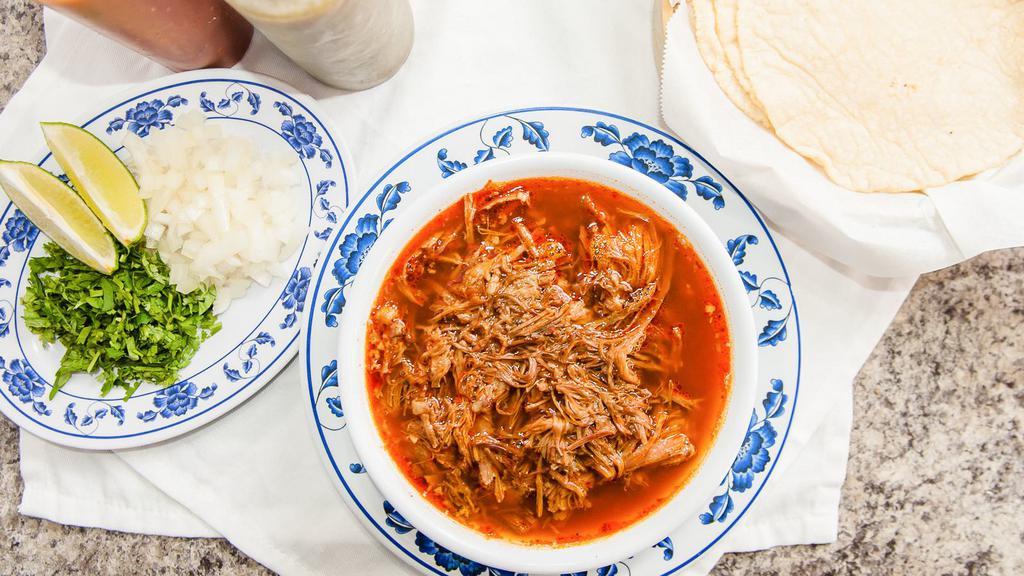 Birria · 32 ounces of goat stew in a hearty red broth. Served with your choice of tortillas, fresh onions, cilantro, limes, red and green salsa to prepare to taste.