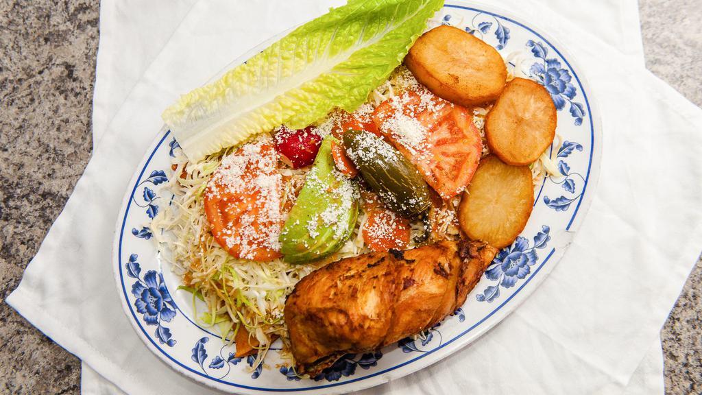Michoacan Enchiladas · Five corn tortillas dipped in a red sauce and lightly fried, filled with a bit of Cotija cheese and pickled onion and folded. Topped with shredded cabbage, radish, avocado, jalapeño, tomato, deep-fried potatoes, house tomato sauce, Cotija cheese and your choice of meat.