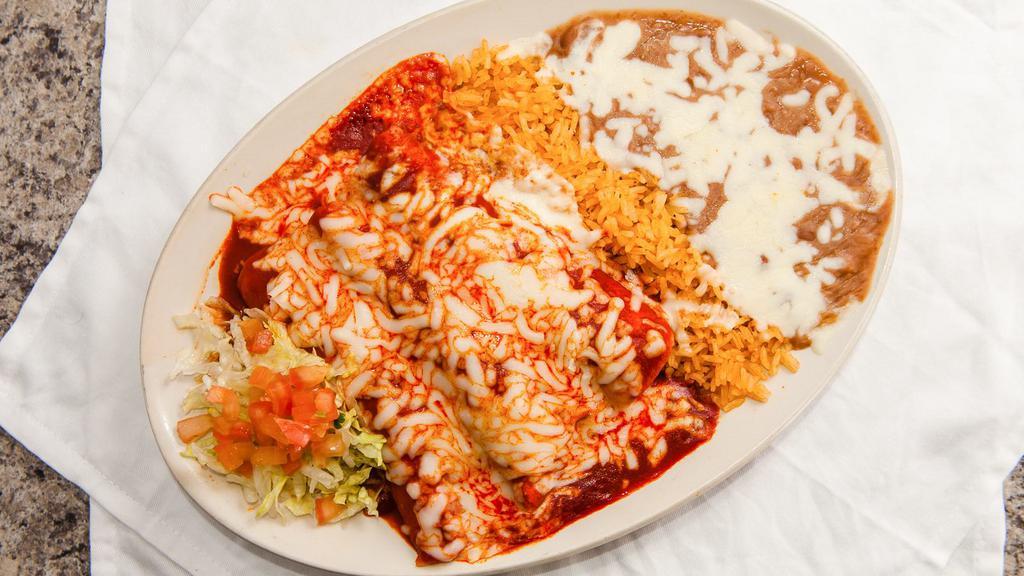 Enchiladas Suizas · Three rolled corn tortilla enchiladas with your choice of meat or cheese covered in your choice of sauce and topped with cheese. Served with Mexican rice and refried beans.