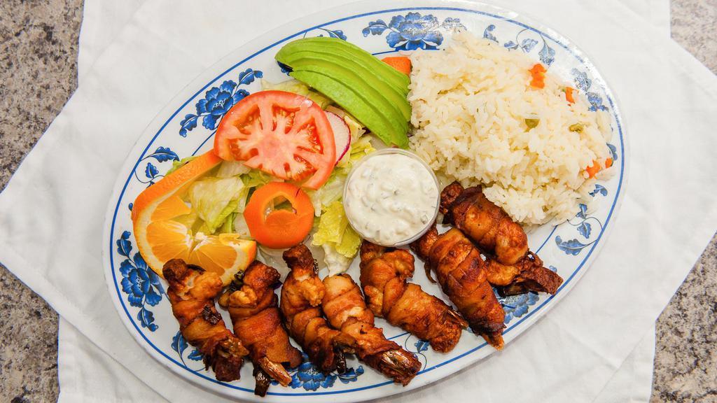 Camarones Mariachi · Deep fried shrimp stuffed with cheese, fresh jalapeño and wrapped in bacon. Served with white Mexican rice, salad and your choice of tortillas.