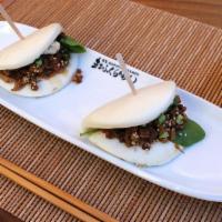 **Marufuku Bites** · Japanese steamed buns filled with homemade pork chashu