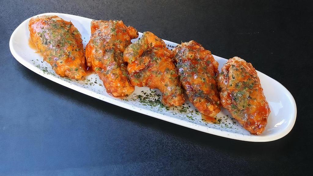 MARUFUKU SPICY WINGS · Chicken Wings with Japanese Aonori sriracha spicy sauce. Chicken Wings, Spicy Sauce and Dried Seaweed Powder