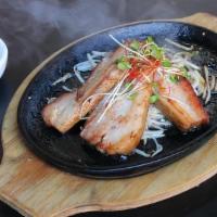 SIZZLING PREMIUM THICK CUT CHASHU · 3pcs of thick cut chashu on very hot sizzling plate. Ingredients: Chashu pork, bean sprouts,...