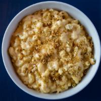 Classic Mac & Cheese · Rich cheddar cheese sauce, touch of cream, parmesan cheese and elbow pasta with baked garlic...