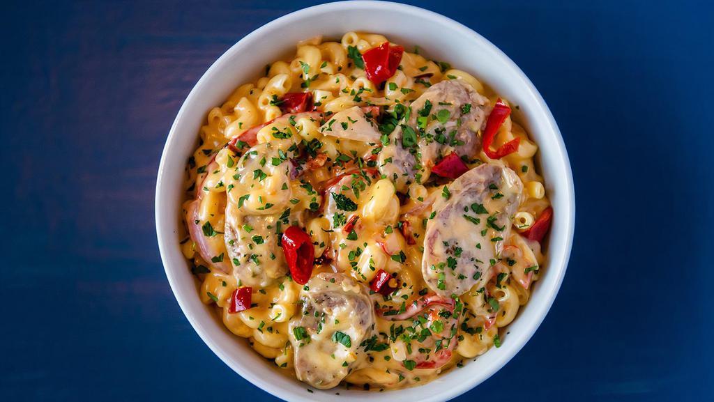 Spicy Calabrian Mac & Cheese · Italian sausage, roasted peppers, onions, calabrian chilies atop our classic mac & cheese.