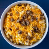 Cheeseburger Mac & Cheese · House-blended browned ground beef mix, sautéed onions atop our classic mac & cheese.