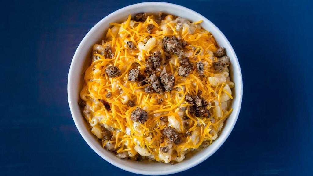 Cheeseburger Mac & Cheese · House-blended browned ground beef mix, sautéed onions atop our classic mac & cheese.