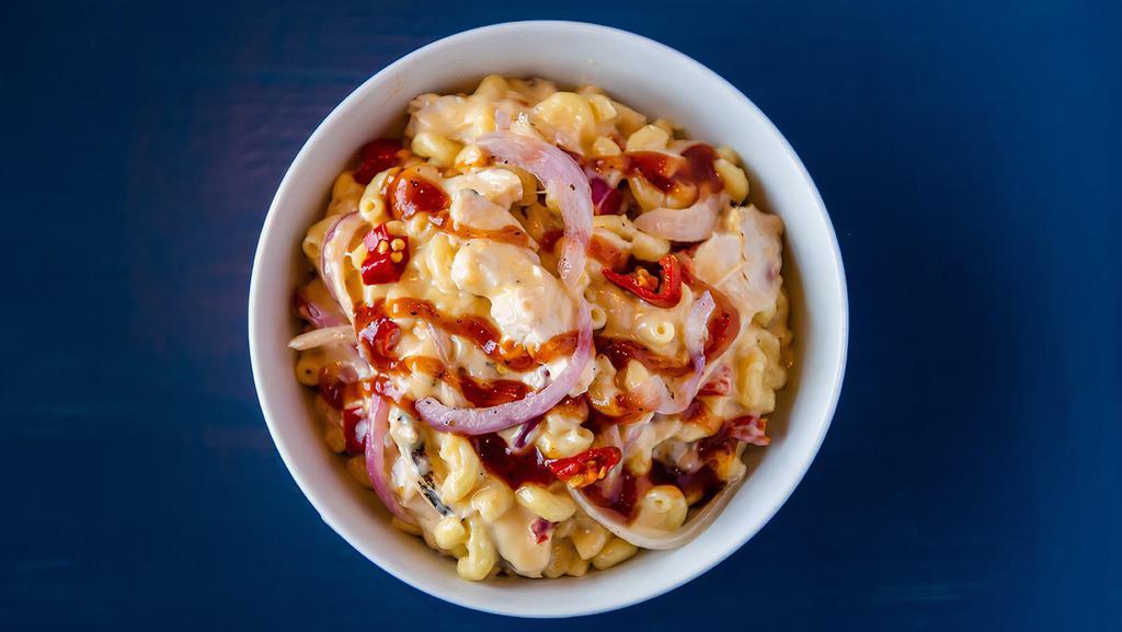 BBQ Mac & Cheese · Grilled chicken, cheddar, red onions, sweet tangy house-made bbq glaze, calabrian peppers on top of our classic mac & cheese.