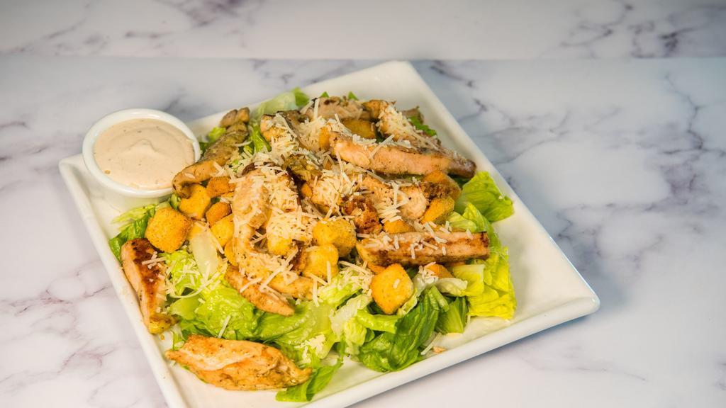 Chicken Caesar Salad · Romaine lettuce Parmesan cheese, croutons, Caesar dressing and chicken.