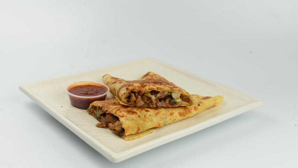 Suiza Quesadilla · Flour tortilla with any meat, cheese and salsa.